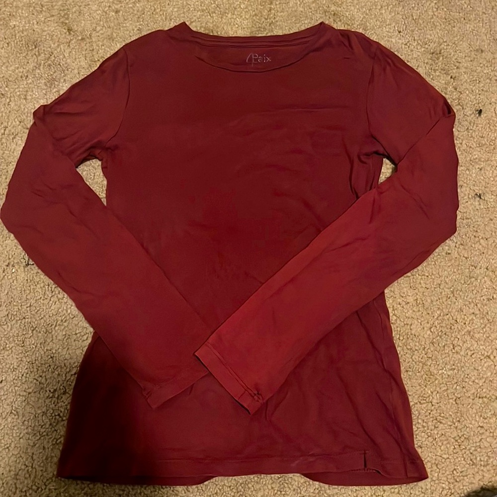 Long sleeve thin shirt, no stains, no holes, a little worn in.